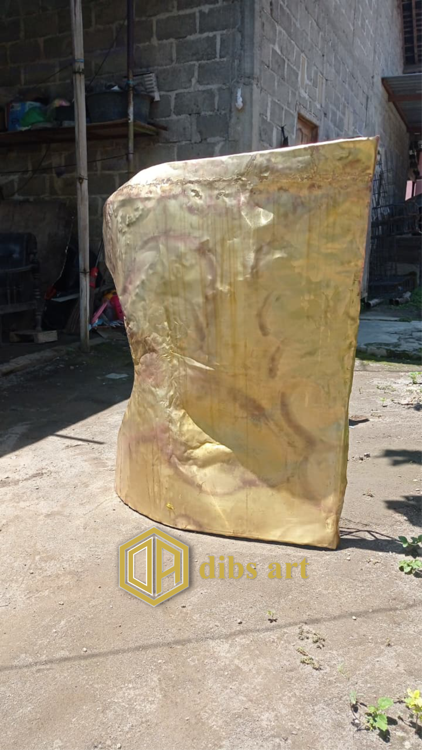 ornamen kuningan batu samping