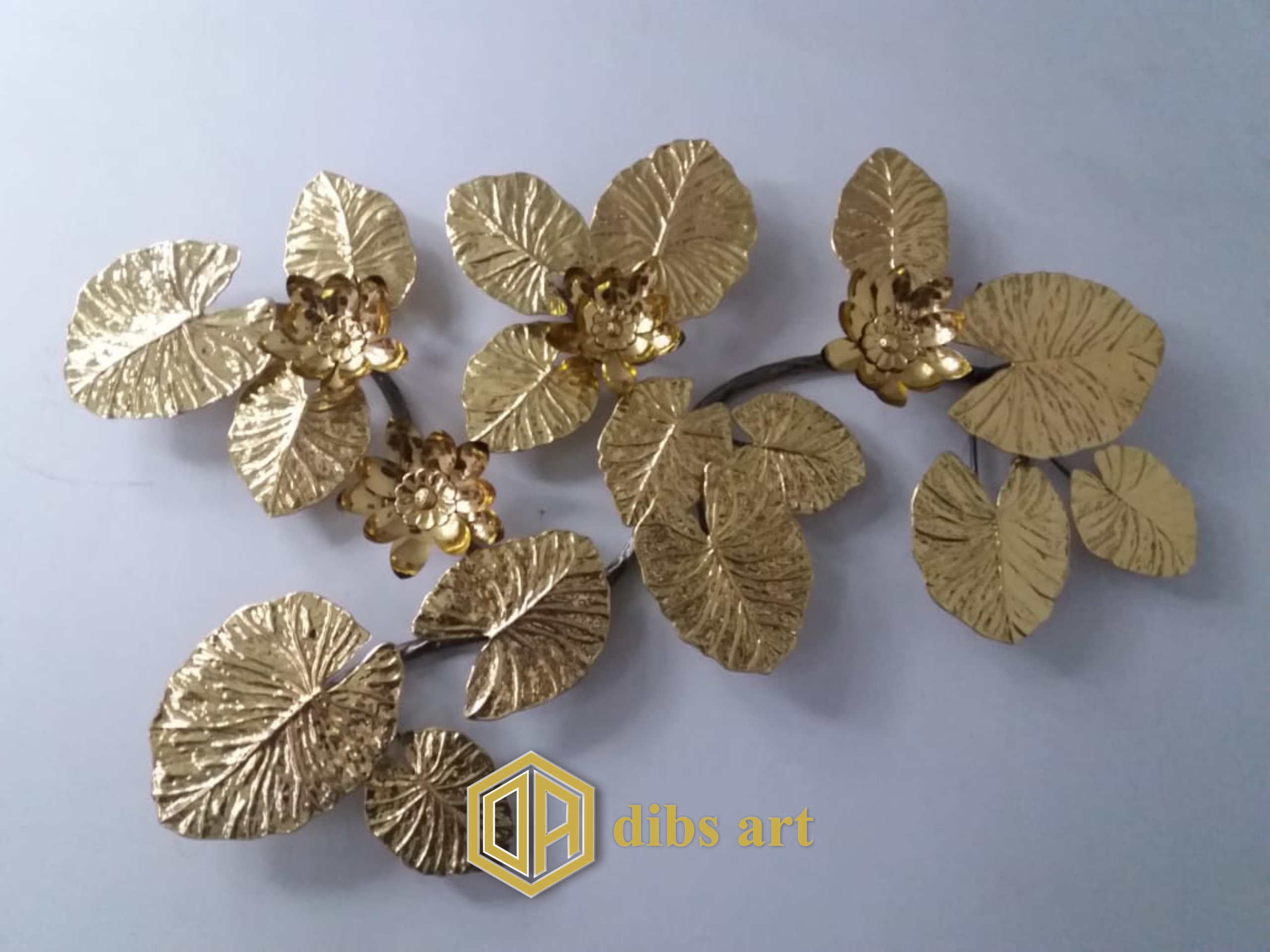 wall decor kuningan dedaunan